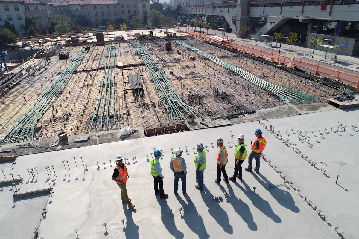 Workers coordinating material delivery